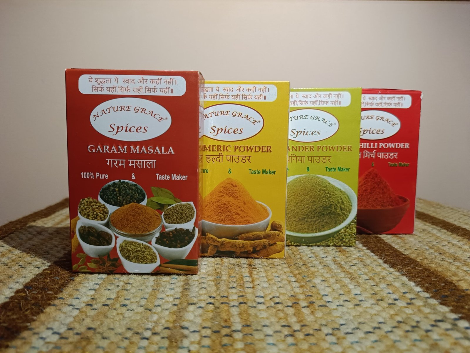 Nature Grace Spices packaging featuring Garam Masala, Turmeric Powder, Coriander Powder, and Chilli Powder.